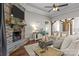 Living room features a stone fireplace, wood floors and a sitting area at 2341 Shiny Leaf Dr, Denver, NC 28037