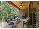 Covered patio features a ceiling fan, outdoor furniture, and wooden ceiling at 2341 Shiny Leaf Dr, Denver, NC 28037