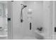 Modern shower with white subway tile, black fixtures, glass door, and convenient corner shelf at 2341 Shiny Leaf Dr, Denver, NC 28037