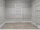 Walk-in closet with open shelving and ample storage space at 2341 Shiny Leaf Dr, Denver, NC 28037