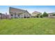 Large backyard with patio and outdoor seating, perfect for entertaining and relaxation at 246 Bushney Loop, Mooresville, NC 28115