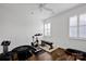 Bright exercise room featuring hardwood floors, an exercise bike, weights, and a mini-trampoline at 246 Bushney Loop, Mooresville, NC 28115