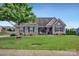 Charming home with stone accents, neat landscaping, and a well-manicured lawn at 246 Bushney Loop, Mooresville, NC 28115