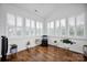 Inviting sunroom filled with natural light and plantation shutters, a perfect space for relaxation at 246 Bushney Loop, Mooresville, NC 28115