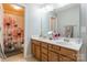 Bathroom featuring a double sink vanity, decorative shower curtain, and neutral color scheme for a serene feel at 261 Catoctin Rd, Rock Hill, SC 29732