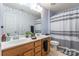 The bathroom features a double vanity and ample lighting, enhanced by a decorative star wallpaper at 261 Catoctin Rd, Rock Hill, SC 29732