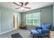 Bonus room features a serene blue accent wall, a cozy seating area, natural light and a peaceful atmosphere at 261 Catoctin Rd, Rock Hill, SC 29732