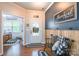 Inviting entryway featuring hardwood floors, custom wall paneling, and stylish decor at 261 Catoctin Rd, Rock Hill, SC 29732