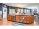Kitchen with wooden cabinets, stainless steel dishwasher and sink, and an adjacent living area at 261 Catoctin Rd, Rock Hill, SC 29732