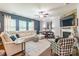 Spacious living room features a cozy fireplace, plush seating, and lots of natural light at 261 Catoctin Rd, Rock Hill, SC 29732