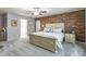 Large main bedroom boasts a wooden accent wall, plush carpet, and an ensuite bathroom at 261 Catoctin Rd, Rock Hill, SC 29732