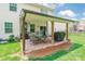 Inviting covered patio, perfect for outdoor dining, and relaxing with views of the green backyard and surrounding landscape at 261 Catoctin Rd, Rock Hill, SC 29732