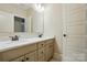 Bathroom with double vanity, white countertop and cabinets at 300 Wheatberry Hill Dr, Weddington, NC 28104