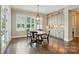 Sunlit breakfast nook features custom cabinets at 300 Wheatberry Hill Dr, Weddington, NC 28104