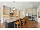 Bright kitchen boasts granite countertops, pendant lighting, and stainless steel appliances at 300 Wheatberry Hill Dr, Weddington, NC 28104