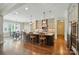 Open-concept kitchen features a large island, stainless appliances, and hardwood floors at 300 Wheatberry Hill Dr, Weddington, NC 28104
