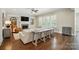 Cozy living room featuring a fireplace, plush seating, and natural light, perfect for relaxing and entertaining at 300 Wheatberry Hill Dr, Weddington, NC 28104