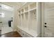 Mudroom featuring built in bench and storage cubbies with hooks and drawers at 300 Wheatberry Hill Dr, Weddington, NC 28104