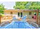 Inviting back deck with outdoor seating, a colorful rug, and access to the home's interior at 3043 Charles Rd, Shelby, NC 28152