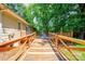 Backyard featuring a wooden deck area leading up to the house, perfect for outdoor enjoyment and relaxation at 3043 Charles Rd, Shelby, NC 28152