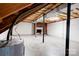 Spacious unfinished basement with a brick fireplace, offering lots of potential for a great living space at 3043 Charles Rd, Shelby, NC 28152
