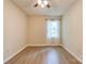 Well-lit bedroom with new floors, neutral paint, and a ceiling fan at 3043 Charles Rd, Shelby, NC 28152