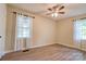 Cozy bedroom featuring neutral paint, updated flooring, and natural light at 3043 Charles Rd, Shelby, NC 28152
