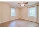 Well-lit bedroom featuring two windows and a ceiling fan at 3043 Charles Rd, Shelby, NC 28152