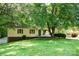 Charming single-story home with a well-maintained lawn and mature trees offering plenty of shade at 3043 Charles Rd, Shelby, NC 28152