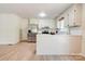 Bright and airy kitchen with stainless steel appliances, white cabinets, subway tile, and modern flooring at 3043 Charles Rd, Shelby, NC 28152