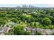 Community aerial showcasing a pond, park, and a distant skyline at 3153 Bending Birch Pl, Charlotte, NC 28206