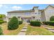 Townhouse backyard with a patio, landscaping, and steps leading to the upper levels at 3153 Bending Birch Pl, Charlotte, NC 28206