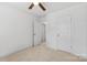 Bright bedroom featuring neutral colors, plush carpeting, and ample closet space at 3153 Bending Birch Pl, Charlotte, NC 28206
