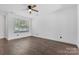 Bright bedroom with hardwood floors and a large window that lets in natural light at 3153 Bending Birch Pl, Charlotte, NC 28206