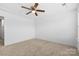 Spacious bedroom with neutral carpet, ceiling fan, and natural light at 3153 Bending Birch Pl, Charlotte, NC 28206