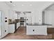 Modern white kitchen featuring stainless steel appliances, a granite countertop, and ample cabinet space at 3153 Bending Birch Pl, Charlotte, NC 28206