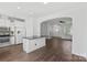 Open concept kitchen features stainless steel appliances and an island with bar seating at 3153 Bending Birch Pl, Charlotte, NC 28206