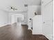 Open-concept living room with hardwood floors and direct access to the staircase at 3153 Bending Birch Pl, Charlotte, NC 28206
