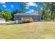Expansive backyard showcases the home's new deck and the lush surrounding landscape at 338 Hollingswood Dr, Statesville, NC 28625
