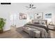 This bedroom features a ceiling fan, neutral walls, and new flooring at 338 Hollingswood Dr, Statesville, NC 28625