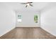 This bedroom features neutral walls, a ceiling fan, and new flooring at 338 Hollingswood Dr, Statesville, NC 28625