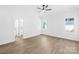 This bedroom features neutral walls, new flooring, and an adjoining bathroom at 338 Hollingswood Dr, Statesville, NC 28625