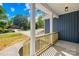 Inviting front porch with stained wood railing offers a charming curb appeal at 338 Hollingswood Dr, Statesville, NC 28625