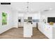 Bright kitchen with stainless steel appliances, white cabinets, and blue tile backsplash at 338 Hollingswood Dr, Statesville, NC 28625