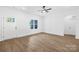 Room with hardwood floors, ceiling fan, one window, and a white door at 338 Hollingswood Dr, Statesville, NC 28625