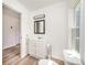 Bathroom with a single vanity, toilet, and a window allowing natural light to flow through at 3595 Mt Holly Rd, Edgemoor, SC 29712