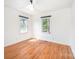 Bright bedroom with hardwood floors and two windows offering natural light and pleasant views at 3595 Mt Holly Rd, Edgemoor, SC 29712