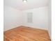 A bright bedroom with hardwood floors and a window to let in natural light at 3595 Mt Holly Rd, Edgemoor, SC 29712