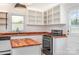 A well-lit kitchen with white cabinets, butcher block countertops, and stainless steel appliances at 3595 Mt Holly Rd, Edgemoor, SC 29712