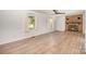 Bright living room with a decorative brick fireplace, ceiling fan, and wood-look floors at 3595 Mt Holly Rd, Edgemoor, SC 29712
